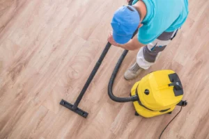 men- vacuuming apartment for ultra clean