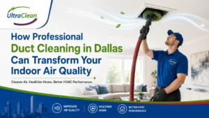 HVAC technician in a blue uniform cleans a ceiling vent with a hose in a bright living room, promoting professional duct cleaning in Dallas.