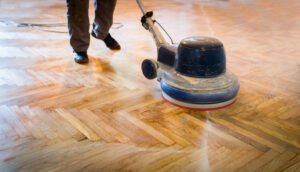 Protecting hardwood floors in McKinney — Ultra Clean | Ultra Clean Polished hardwood floor in a McKinney home — wax-and-buildup strip with Revitalization by Ultra Clean