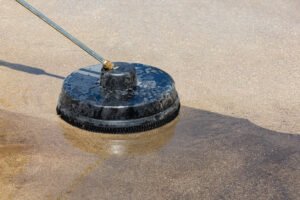 Power washing a Dallas driveway and exterior — Ultra Clean removes dirt, mildew, and stains from concrete and siding