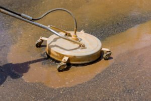 Power washing a Plano home driveway and siding — Ultra Clean restores concrete and brick to like-new