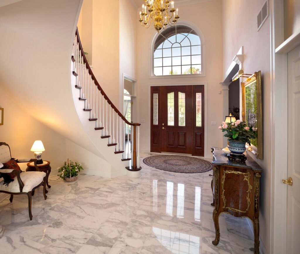 Professionally polished white marble floor in a Plano home, restored to a glossy mirror-like shine